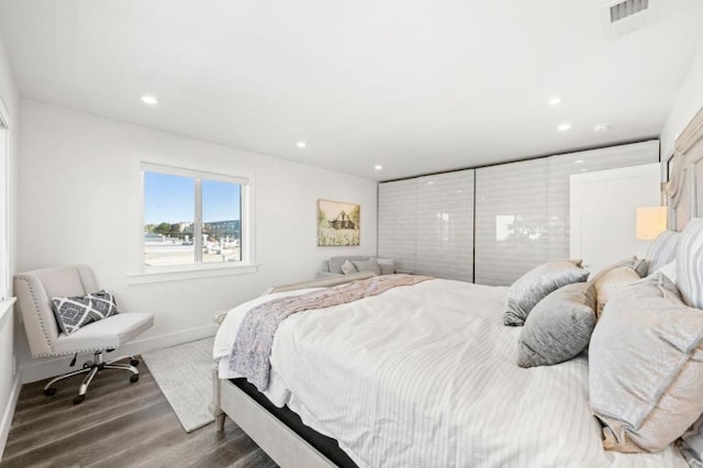 bedroom featuring dark hardwood / wood-style floors