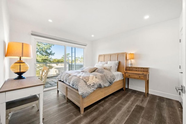 bedroom featuring dark wood-type flooring and access to outside