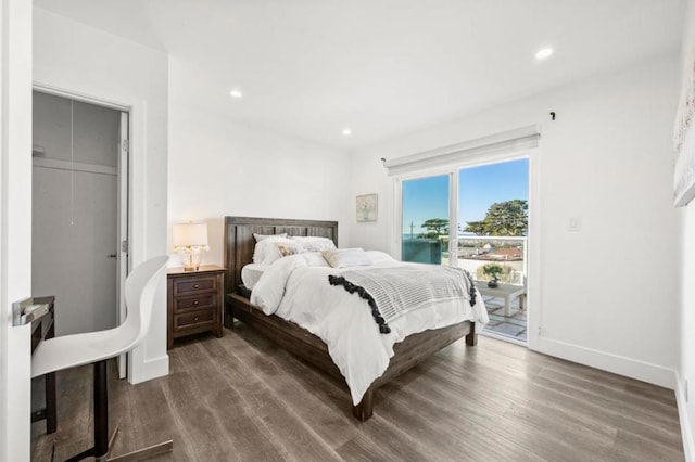 bedroom featuring dark wood-type flooring and access to outside