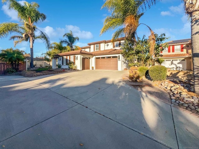 mediterranean / spanish home with a garage