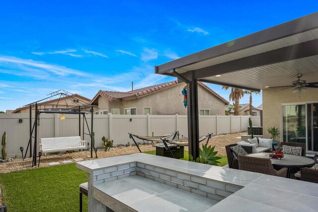 view of patio / terrace featuring outdoor lounge area and ceiling fan