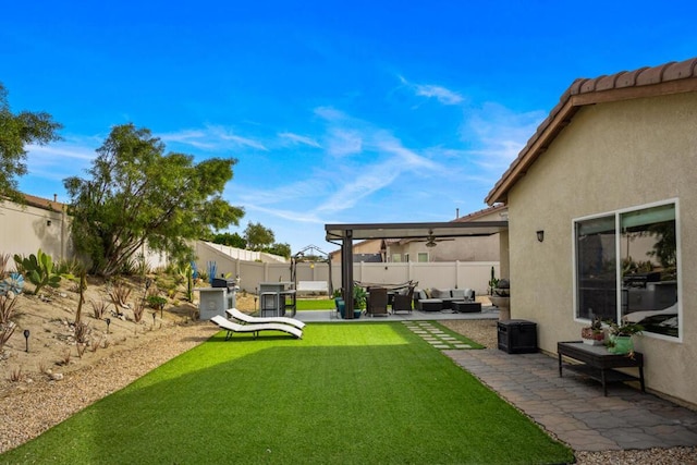 view of yard with outdoor lounge area, a pergola, and a patio area