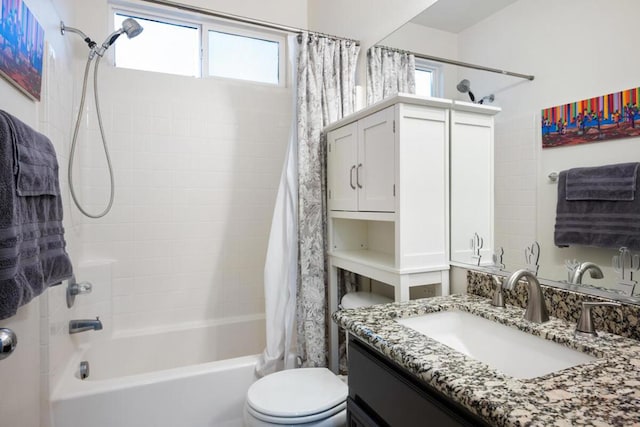 full bathroom featuring shower / bath combination with curtain, vanity, and toilet