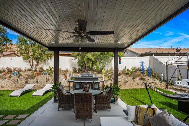 view of patio with ceiling fan