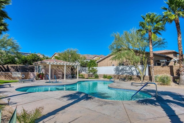 view of swimming pool with a pergola and a patio