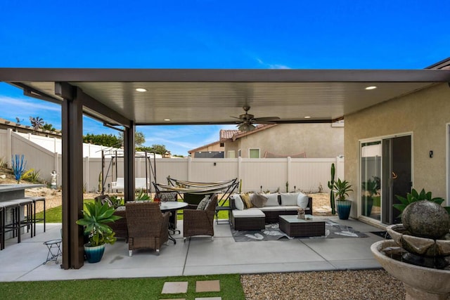 view of patio featuring an outdoor living space and ceiling fan