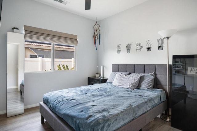 bedroom featuring wood-type flooring and ceiling fan