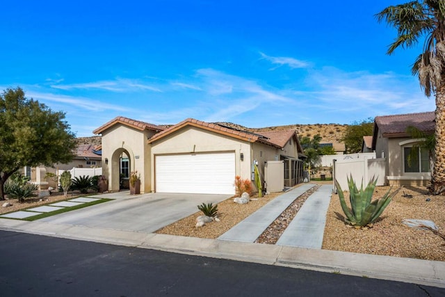 mediterranean / spanish-style house featuring a garage