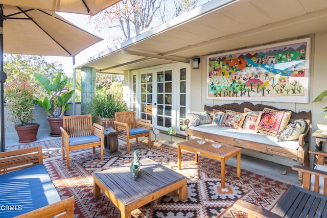 view of patio featuring an outdoor living space and french doors