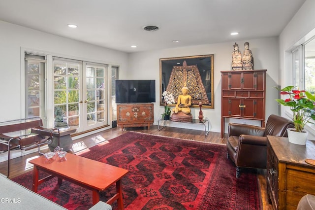 living room featuring french doors and hardwood / wood-style floors