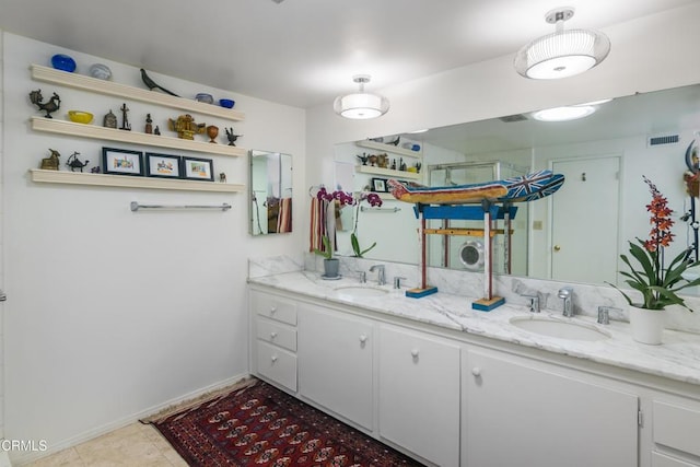 bathroom featuring vanity and tile patterned flooring