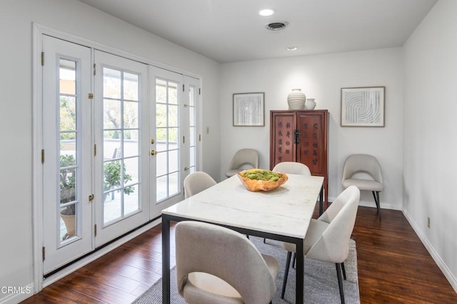 dining room featuring dark wood-style floors, french doors, recessed lighting, visible vents, and baseboards