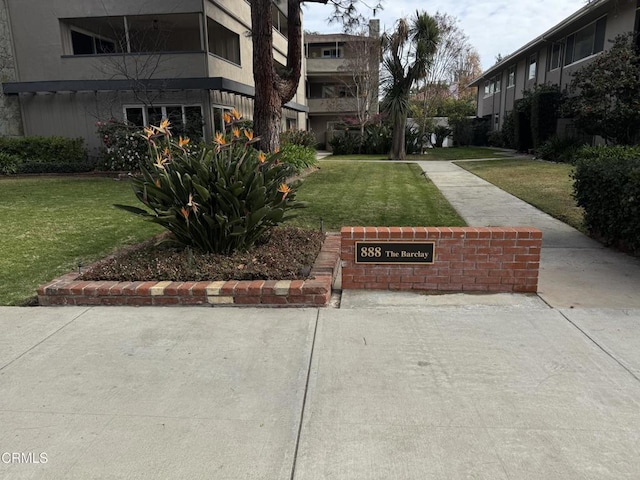 view of home's community with a lawn