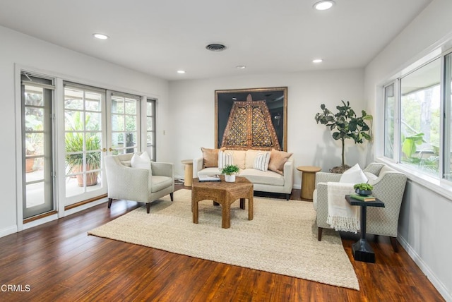 sitting room featuring recessed lighting, wood finished floors, visible vents, baseboards, and french doors