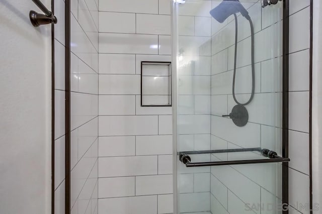 bathroom featuring an enclosed shower