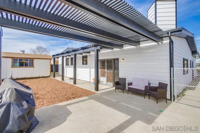 view of patio with an outdoor structure and a pergola