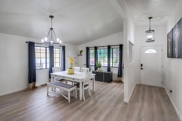 dining room featuring a chandelier, hardwood / wood-style floors, and a wealth of natural light