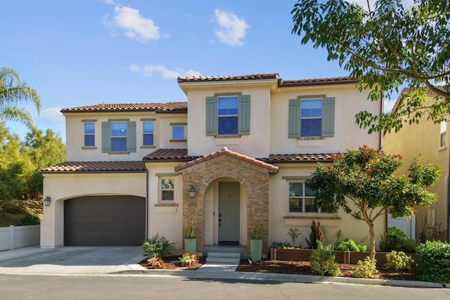 mediterranean / spanish house featuring a garage