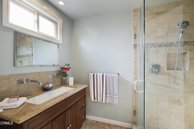 bathroom featuring vanity and walk in shower