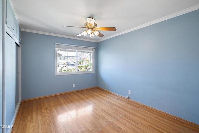 unfurnished bedroom with ceiling fan, ornamental molding, and light hardwood / wood-style flooring