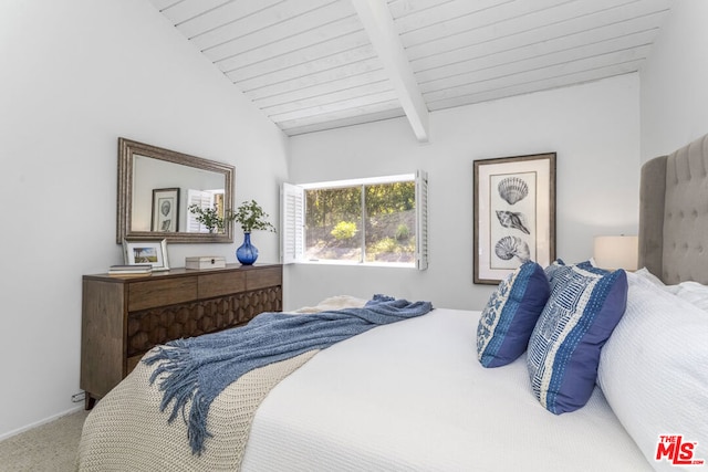 carpeted bedroom with lofted ceiling with beams