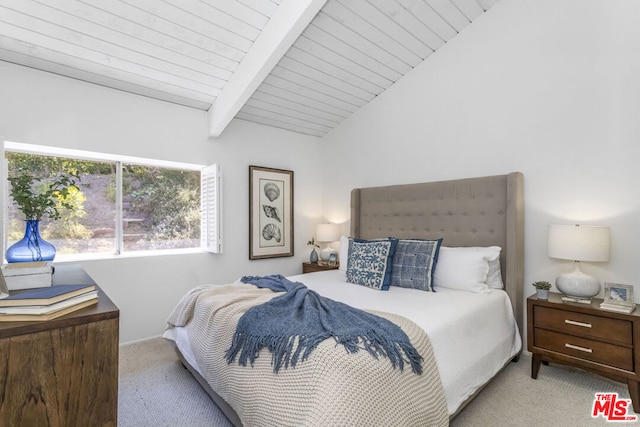 carpeted bedroom with lofted ceiling with beams and wood ceiling