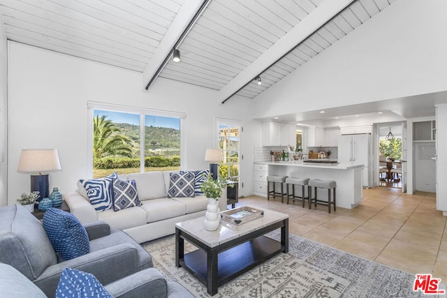 living room with light tile patterned floors, wood ceiling, high vaulted ceiling, and beamed ceiling