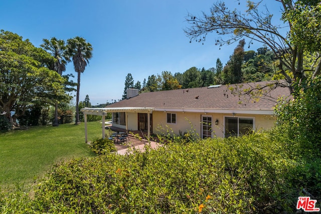 back of house with a pergola, a yard, central AC unit, and a patio area