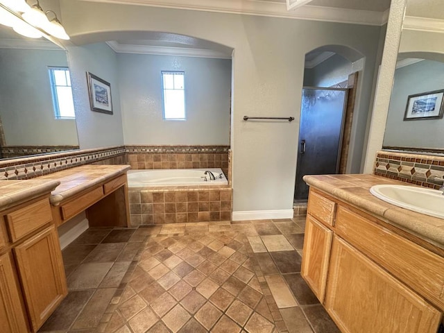 bathroom featuring tasteful backsplash, ornamental molding, vanity, and independent shower and bath