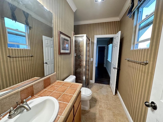 bathroom featuring tile patterned flooring, ornamental molding, vanity, walk in shower, and toilet