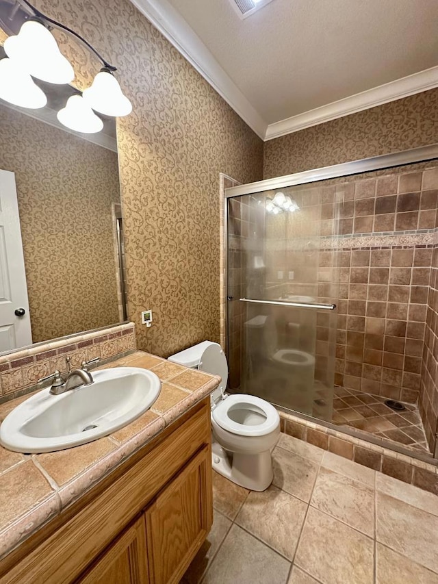 bathroom featuring crown molding, an enclosed shower, vanity, tile patterned floors, and toilet