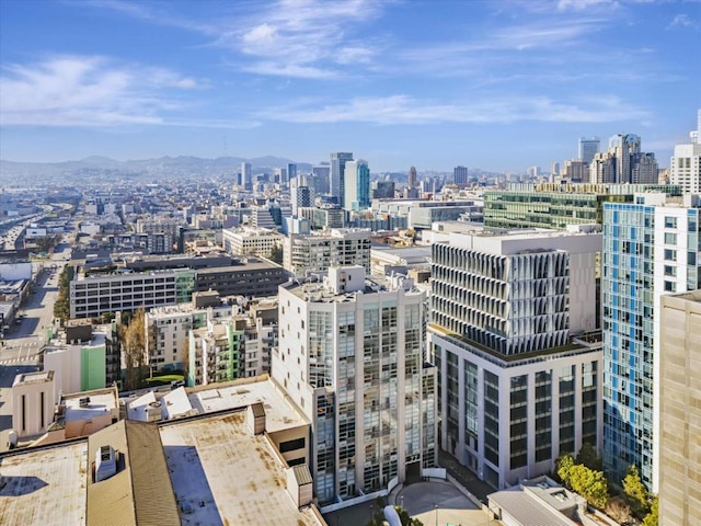 property's view of city with a mountain view