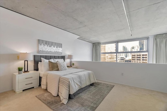 bedroom featuring light colored carpet