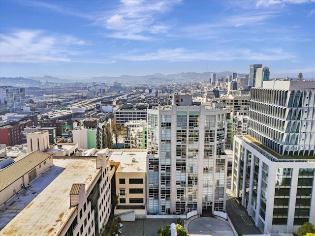 property's view of city with a mountain view