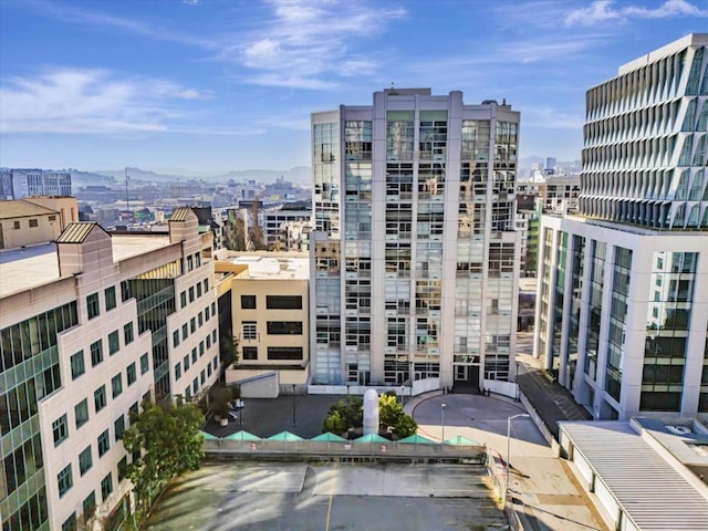 property's view of city with a mountain view