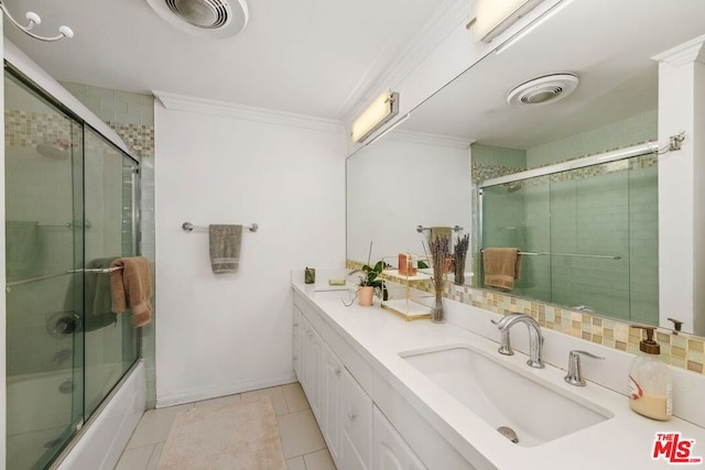 bathroom featuring ornamental molding, tile patterned floors, bath / shower combo with glass door, and vanity