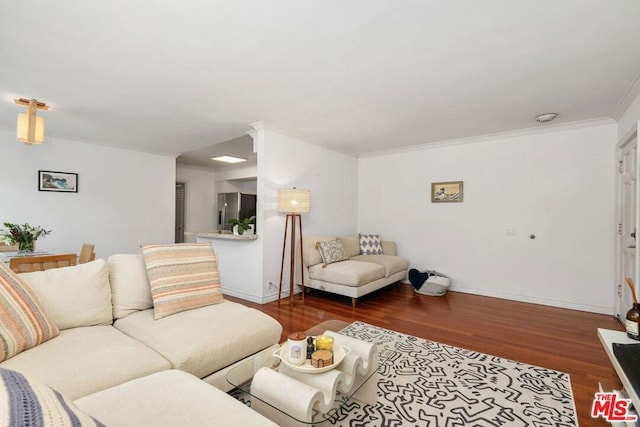 living room with crown molding and dark hardwood / wood-style flooring