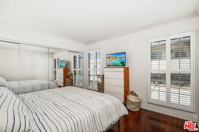 bedroom with crown molding and hardwood / wood-style flooring