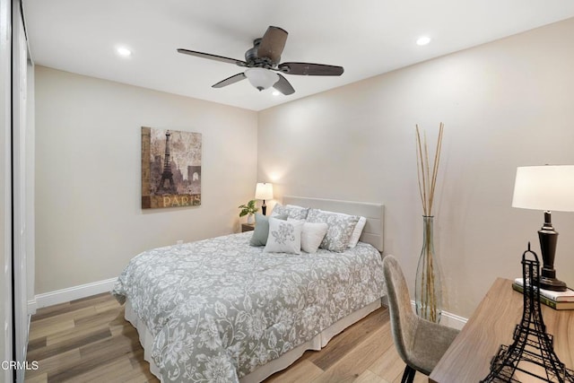 bedroom with wood-type flooring and ceiling fan