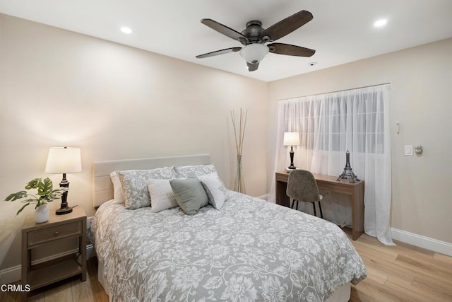 bedroom featuring ceiling fan and light hardwood / wood-style flooring