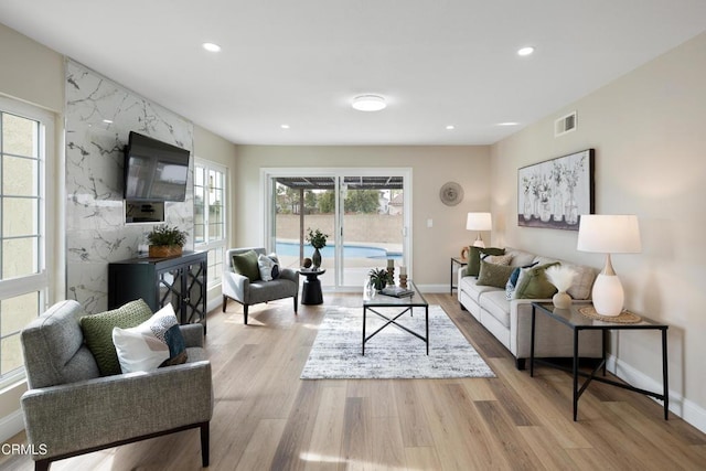 living room with light hardwood / wood-style flooring