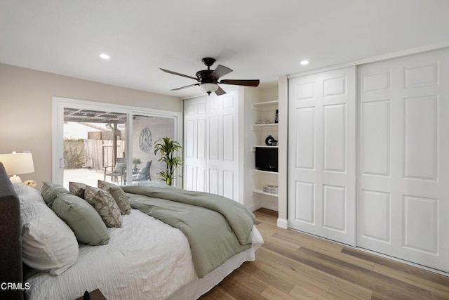 bedroom with ceiling fan, access to exterior, and light hardwood / wood-style floors