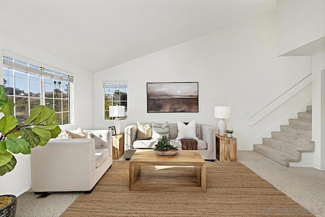 living room featuring vaulted ceiling