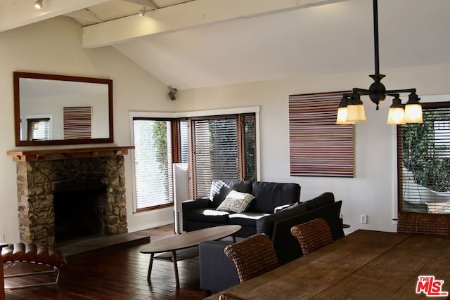 interior space with dark wood-type flooring, a fireplace, a chandelier, and lofted ceiling with beams