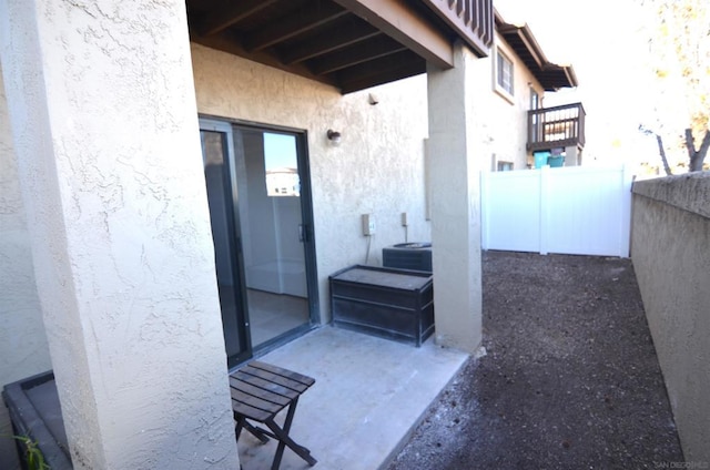 doorway to property featuring central air condition unit