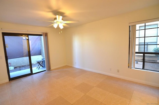 spare room featuring light tile patterned flooring and ceiling fan