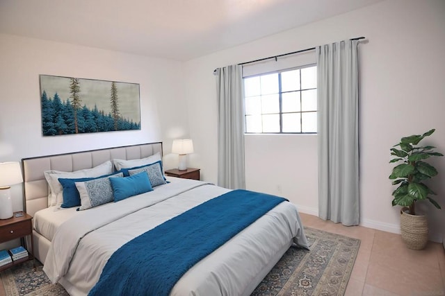 bedroom with light tile patterned flooring