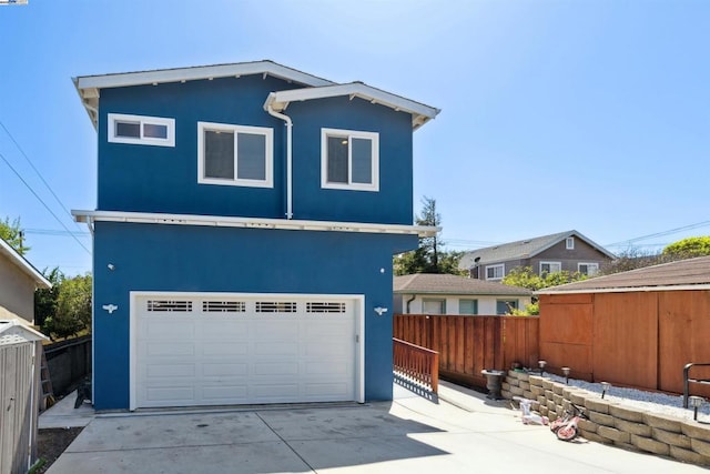 view of front of property featuring an outbuilding and a garage