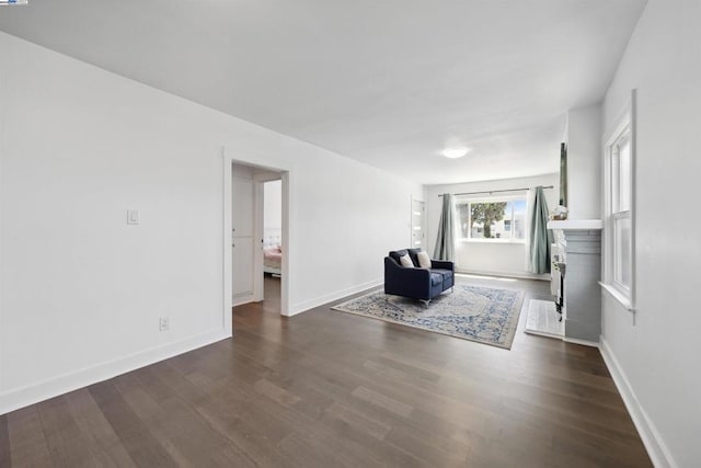 unfurnished room featuring dark wood-type flooring