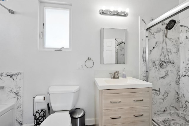 bathroom featuring walk in shower, vanity, and toilet